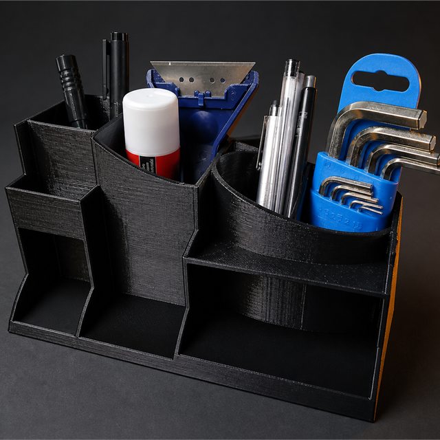 Črn 3D-tiskan organizator orodja in pisal